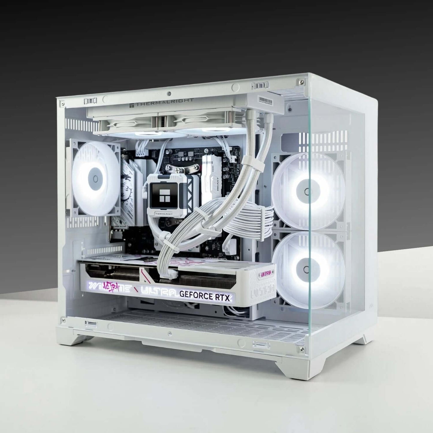 Infinity Mini high-performance PC with AMD Ryzen 5 7600X, GeForce RTX 5070, and Tecware VXN Evo casing in white, showcasing sleek design.
