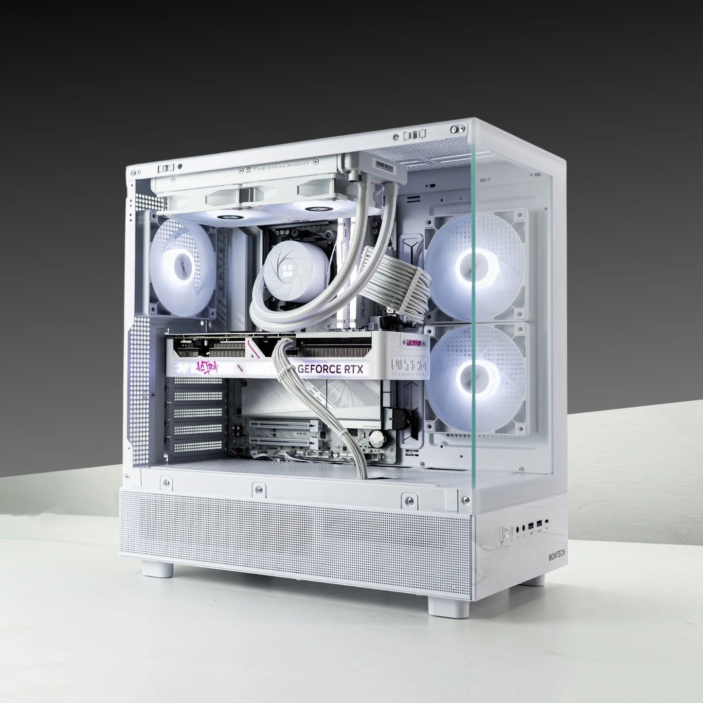 XT White gaming PC with AMD Ryzen 7 7800X3D, GeForce RTX 5070, and RGB lighting in a MONTECH XR ATX case.