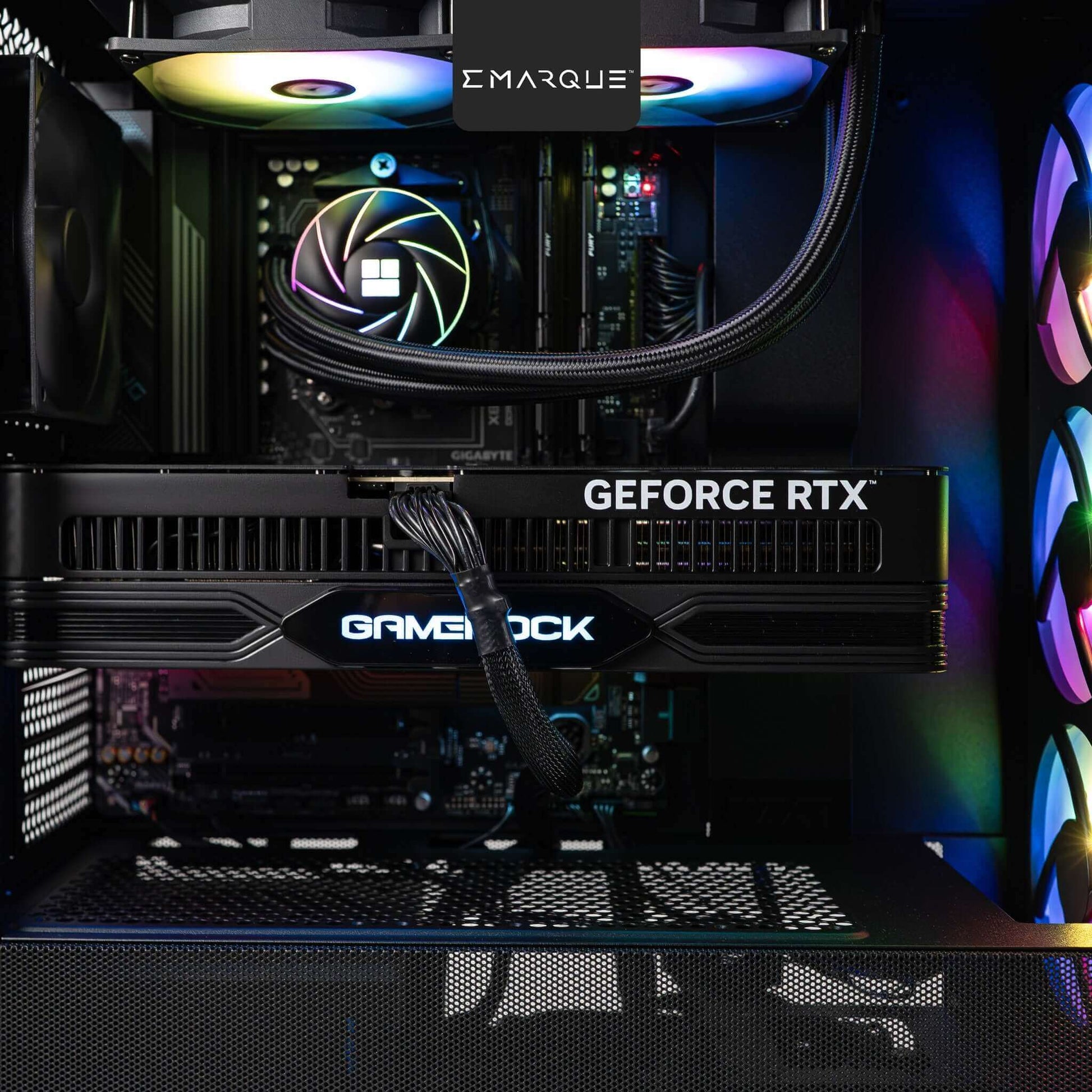 Inside view of EMARQUE FLOW gaming PC with NVIDIA GeForce RTX 5080 graphics card and RGB lighting setup.