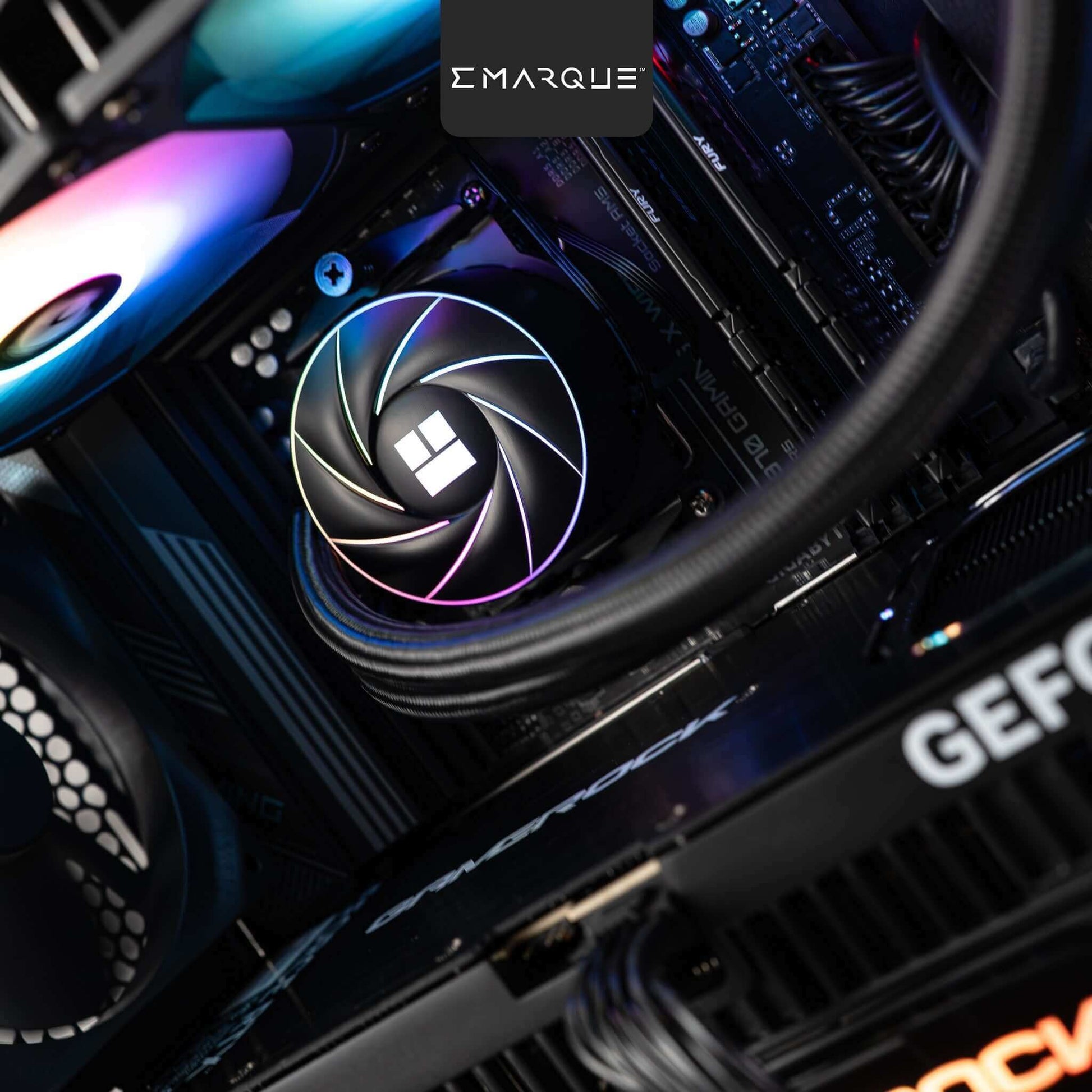 Inside view of EMARQUE FLOW Gaming PC with AMD Ryzen 7 9800X3D and GeForce RTX 5080, featuring RGB cooling fan.