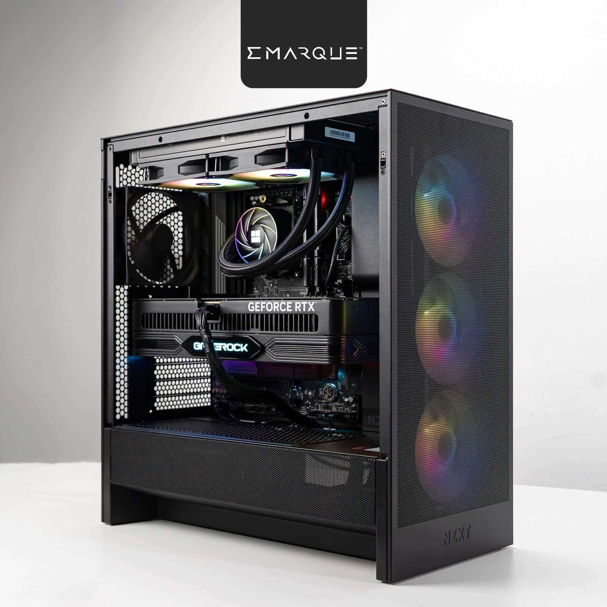 EMARQUE FLOW gaming PC with AMD Ryzen 7 9800X3D processor and GeForce RTX 5080 graphics card, featuring RGB lighting.