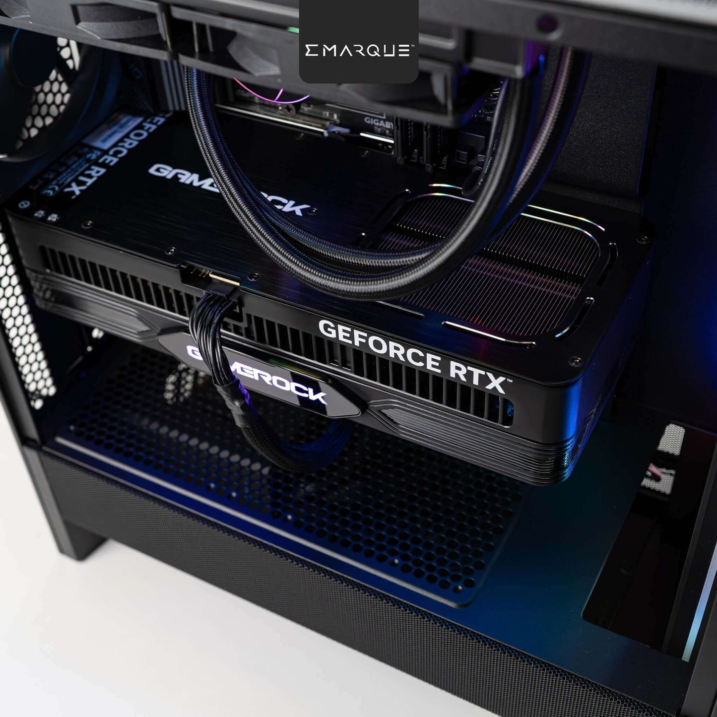 Close-up of EMARQUE FLOW gaming PC with GeForce RTX 5080 graphics card showcasing advanced cooling and design features.