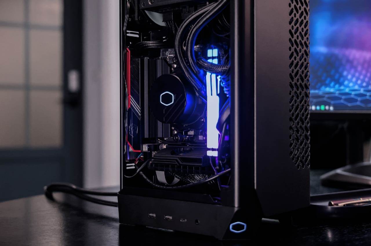 Cooler Master NCORE PC for racing simulation with RGB lighting, showcasing high-performance components for immersive gaming.