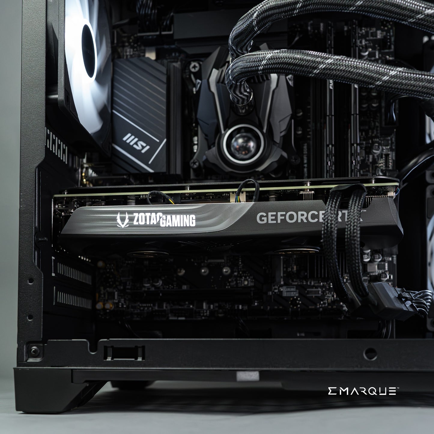 Inside view of EMARQUE workstation featuring AMD Ryzen 7 9700X, GeForce RTX 5070, and MSI components for high-performance tasks.