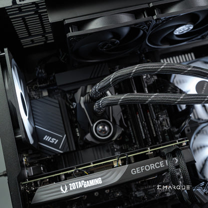 Interior view of EMARQUE workstation featuring AMD Ryzen 7 9700X and GeForce RTX 5070 with MSI motherboard and ZOTAC GAMING graphics.