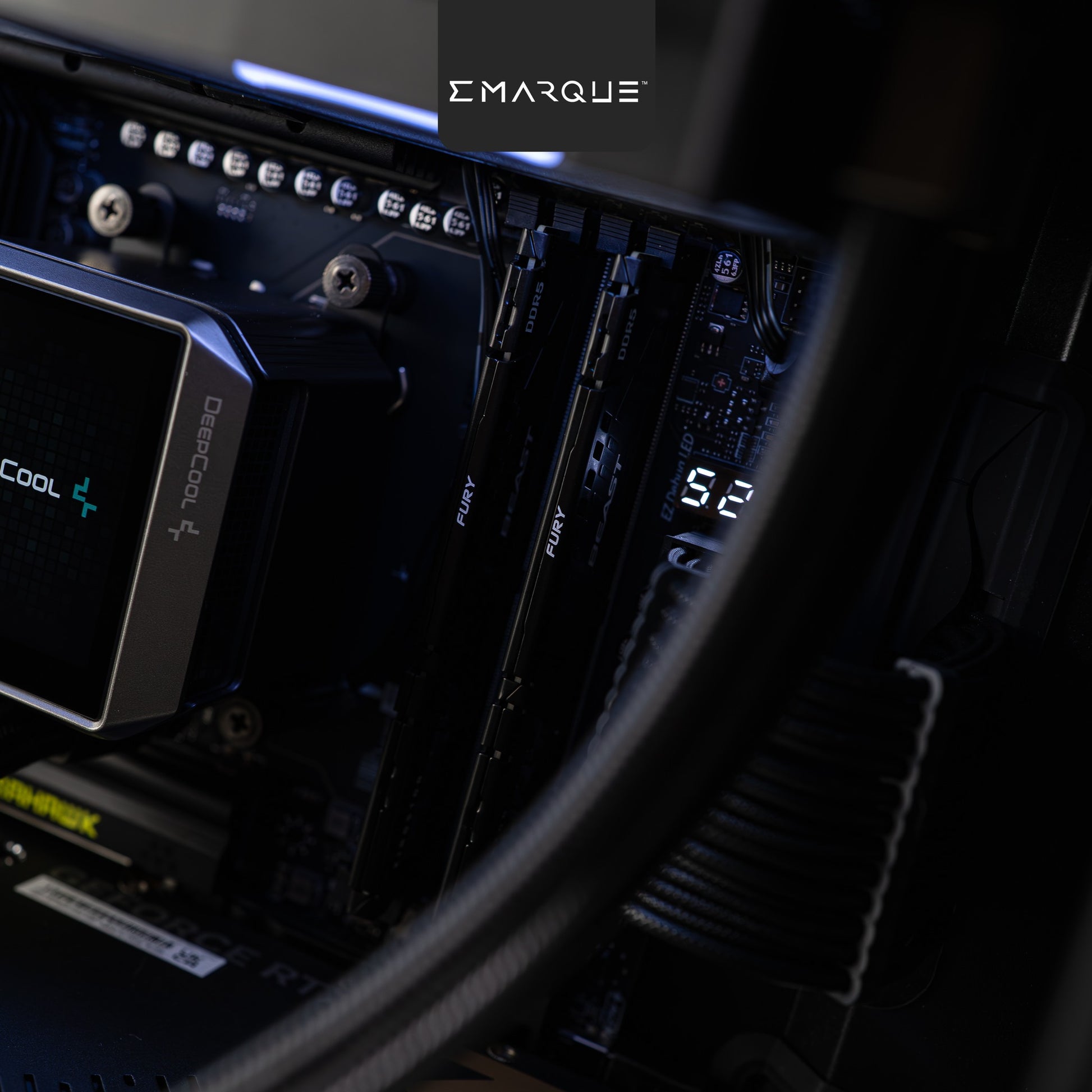 Close-up view of a computer motherboard showing Kingston FURY RAM and Deepcool components, with illuminated details.