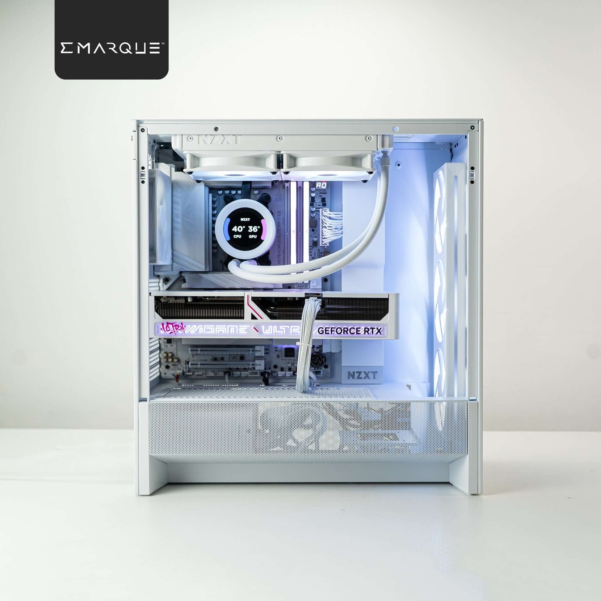 White EMARQUE gaming PC with AMD Ryzen 7 9800X3D and GeForce RTX 5080 visible through transparent side panel.