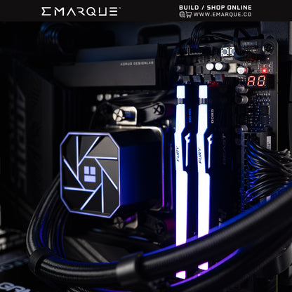 Close-up of AMD Ryzen 7 7800X3D gaming PC build with neon-lit KINGSTON FURY BEAST RGB RAM inside PHANTEKS EVOLV X2 chassis.