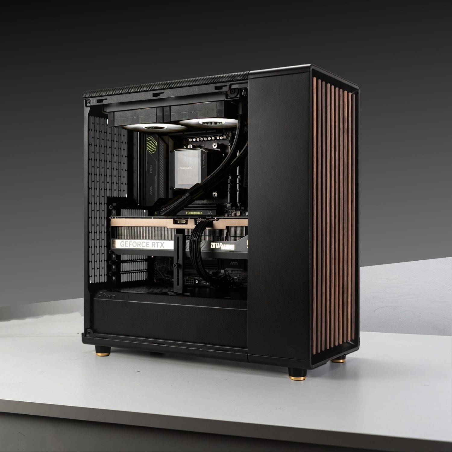 Gaming PC build with AMD Ryzen 7 9800X3D, GeForce RTX 5070 Ti in Fractal Design North Charcoal Black case on gray background.