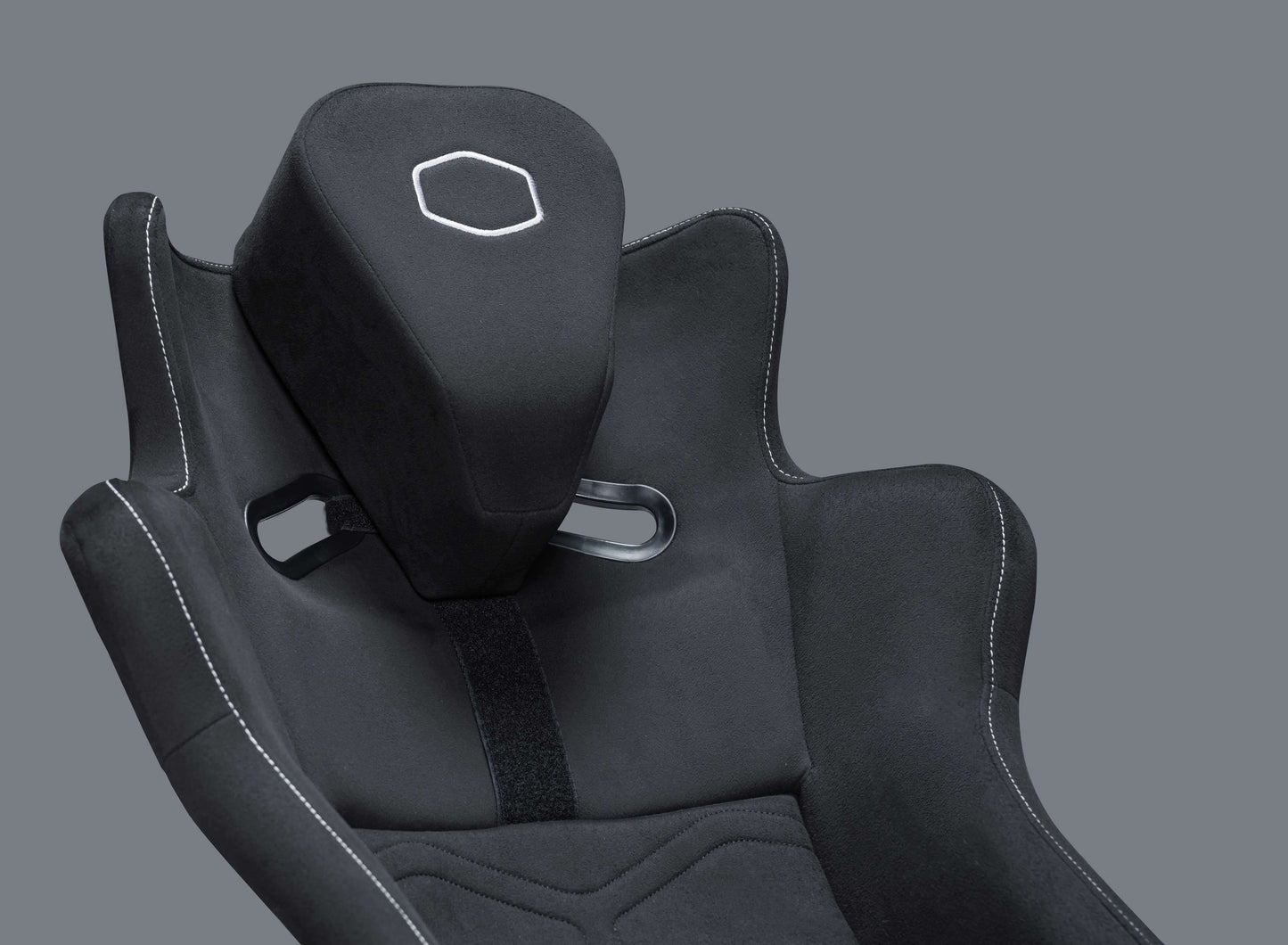 Close-up of DynX Racing Simulator seat with black fabric and ergonomic design.