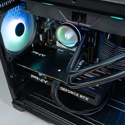 Interior view of a gaming PC featuring a PNY GeForce RTX graphics card and RGB lighting.