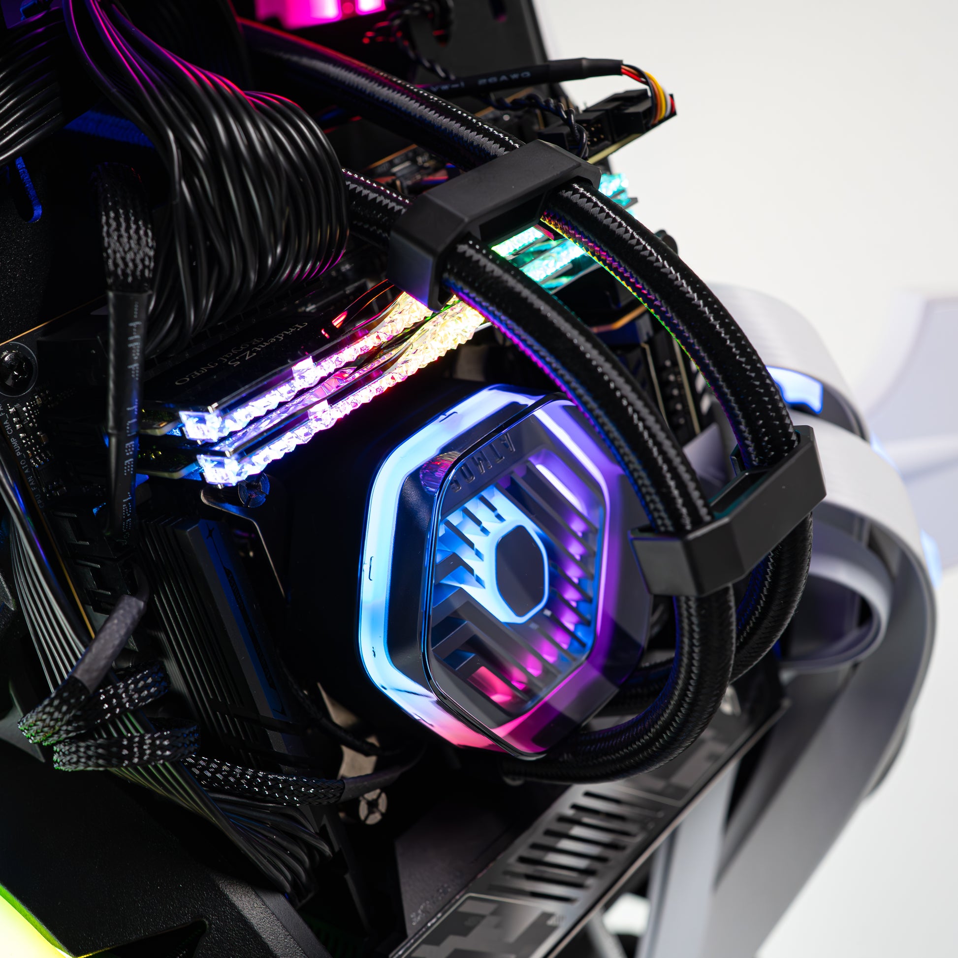 APEX Shark X PC with Intel Core Ultra 9 285K and GeForce RTX 5080, showcasing sleek cables and vibrant LED lighting.