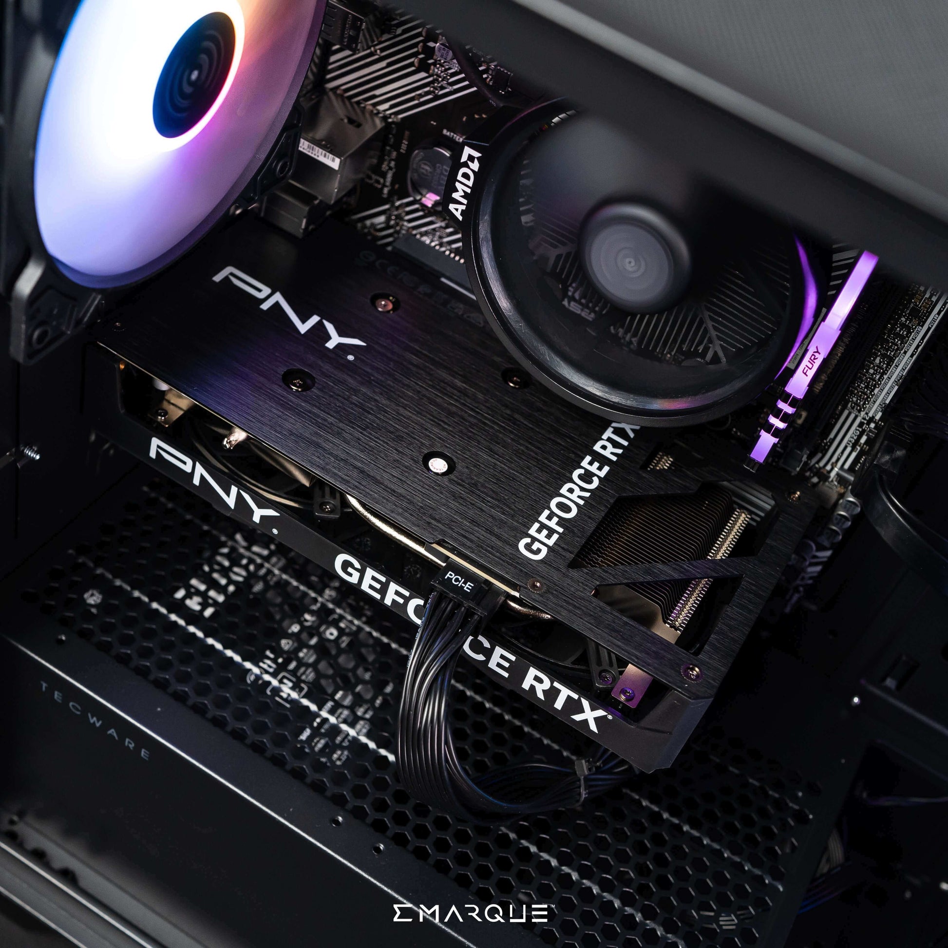 Interior of EMARQUE workstation PC with PNY GeForce RTX graphics card and AMD Ryzen processor, optimized for editing and 3D modeling.