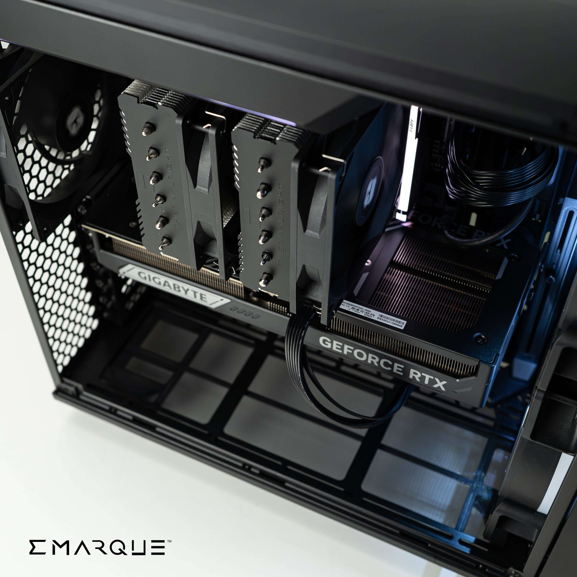 Interior view of gaming PC build with GIGABYTE GeForce RTX graphics card and dual cooling system by EMARQUE. High-performance setup.
