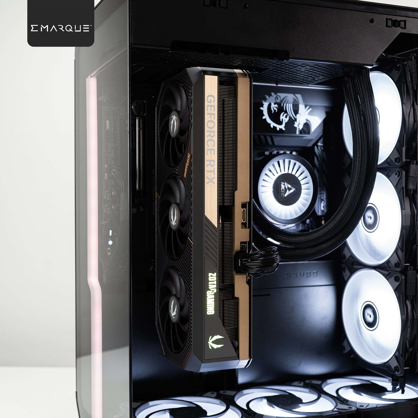 EMARQUE Xhuttle gaming PC with AMD Ryzen 7 9800X3D CPU, ZOTAC GeForce RTX 5090 GPU, and Arctic Liquid Freezer III cooling in black case.