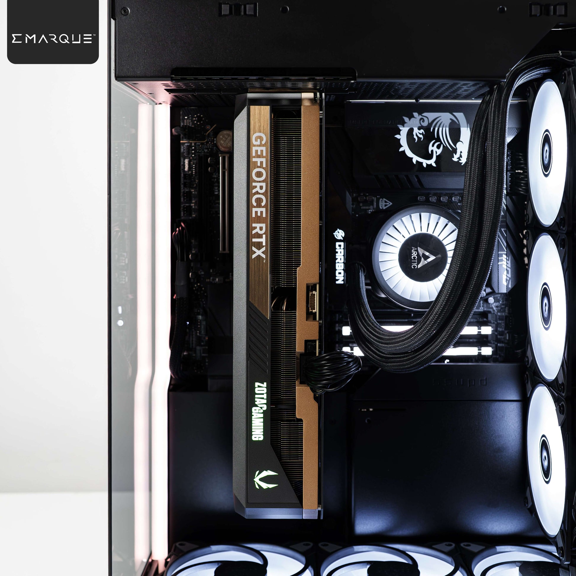 Internal view of EMARQUE Xhuttle gaming PC featuring GeForce RTX 5090 and AMD Ryzen 7 9800X3D in black dual chamber ATX case.