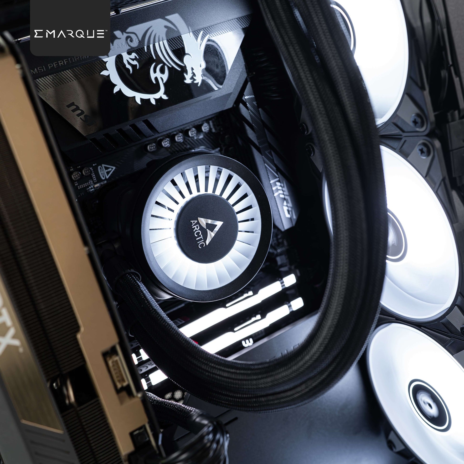 Interior view of EMARQUE Xhuttle PC with Arctic Liquid Freezer, MSI motherboard, featuring RGB lighting and sleek design.