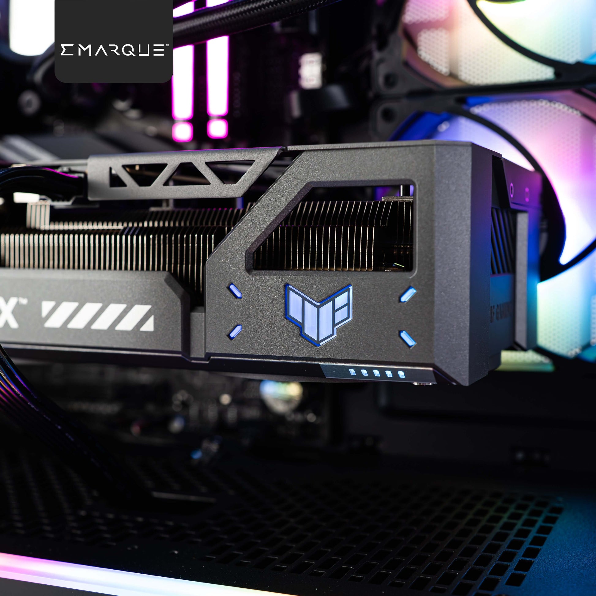 ASUS TUF Gaming GeForce RTX 5080 graphics card inside a Phanteks XT View ATX case with RGB lighting, featuring a vibrant gaming setup.