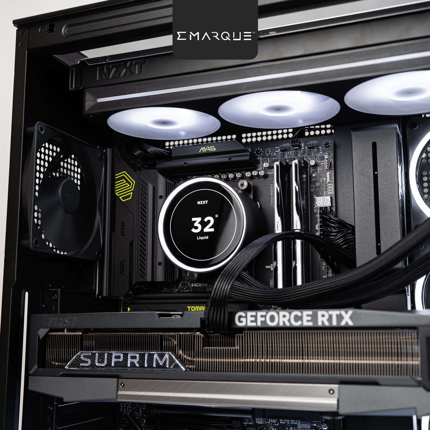 Interior view of gaming PC with AMD Ryzen 7 9800X3D, GeForce RTX 5090, NZXT Kraken cooler, and G.Skill Trident Z5 Neo RGB RAM.