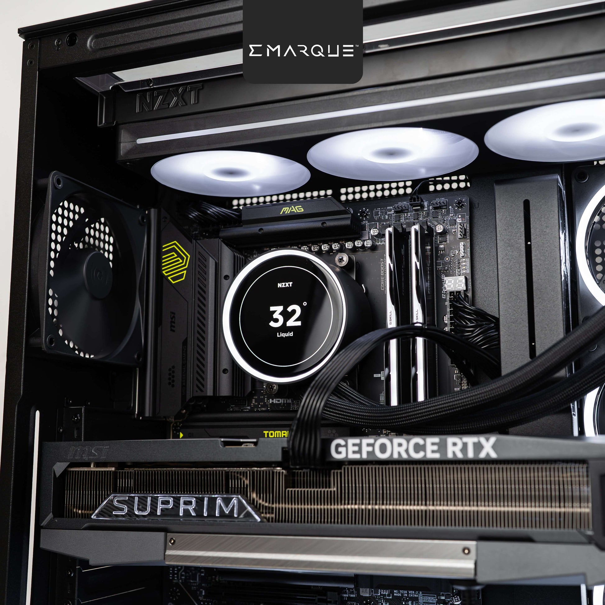 Interior view of gaming PC with AMD Ryzen 7 9800X3D, GeForce RTX 5090, NZXT Kraken cooler, and G.Skill Trident Z5 Neo RGB RAM.