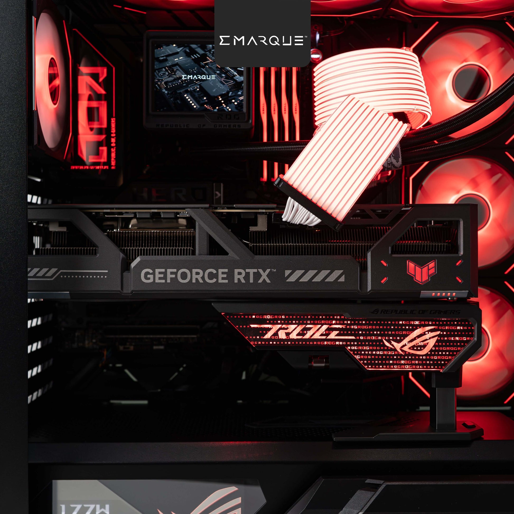 Custom gaming PC with ASUS ROG Astral RTX 5080 graphics card, illuminated interior, and advanced cooling system.