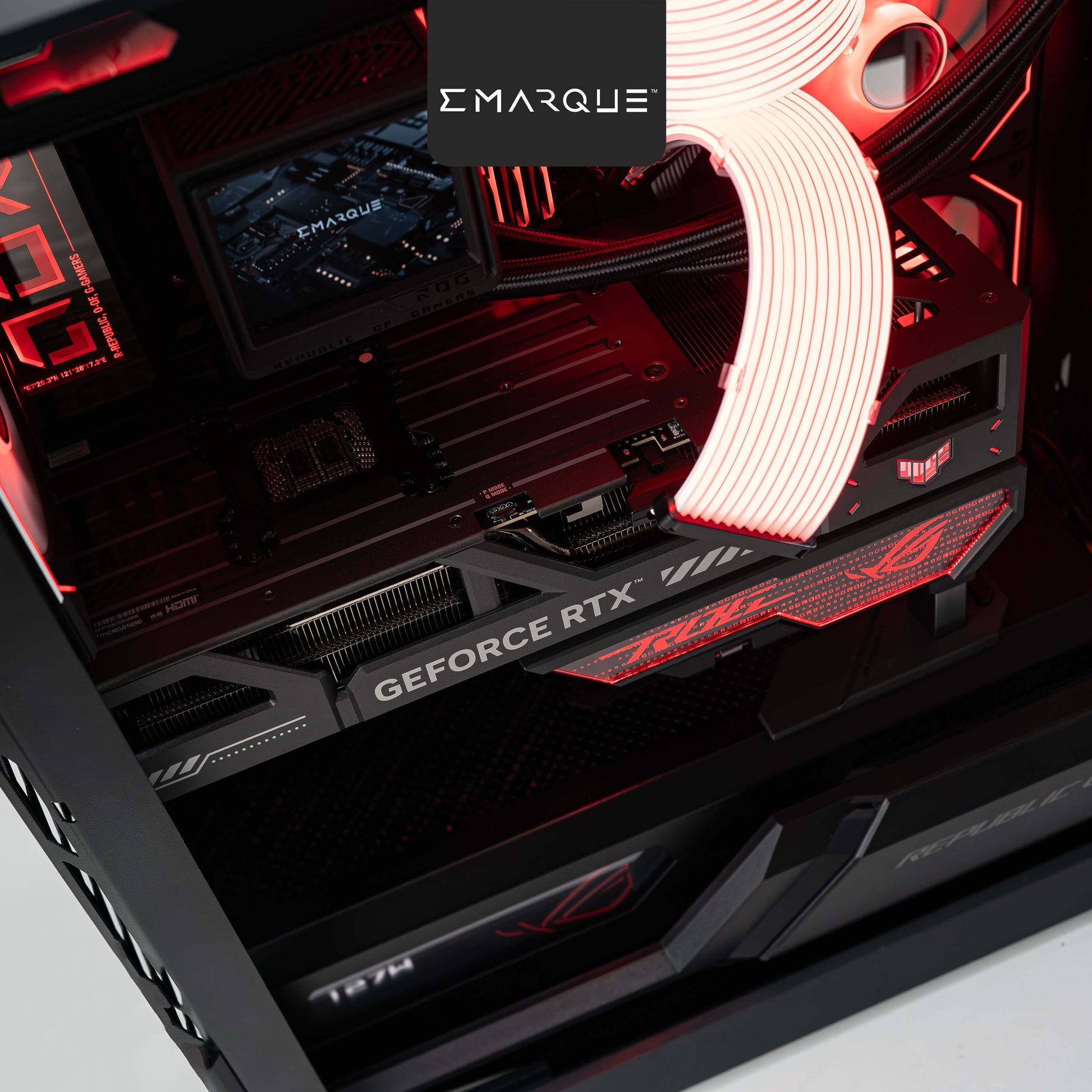 ASUS ROG Gaming PC with GeForce RTX graphics card and red LED lighting inside the chassis.