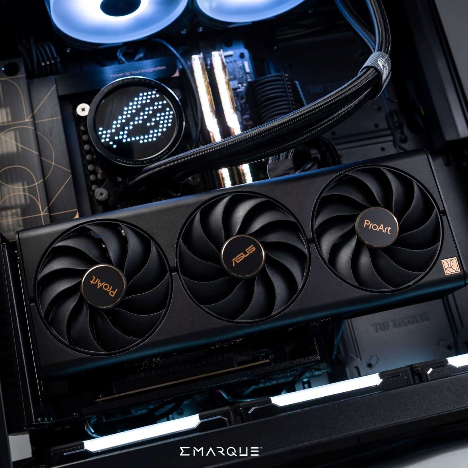 Dual-chamber ASUS TUF Gaming PC with AMD Ryzen 7 9800X3D and GeForce RTX 5080, showing internal cooling and ProArt graphics card.