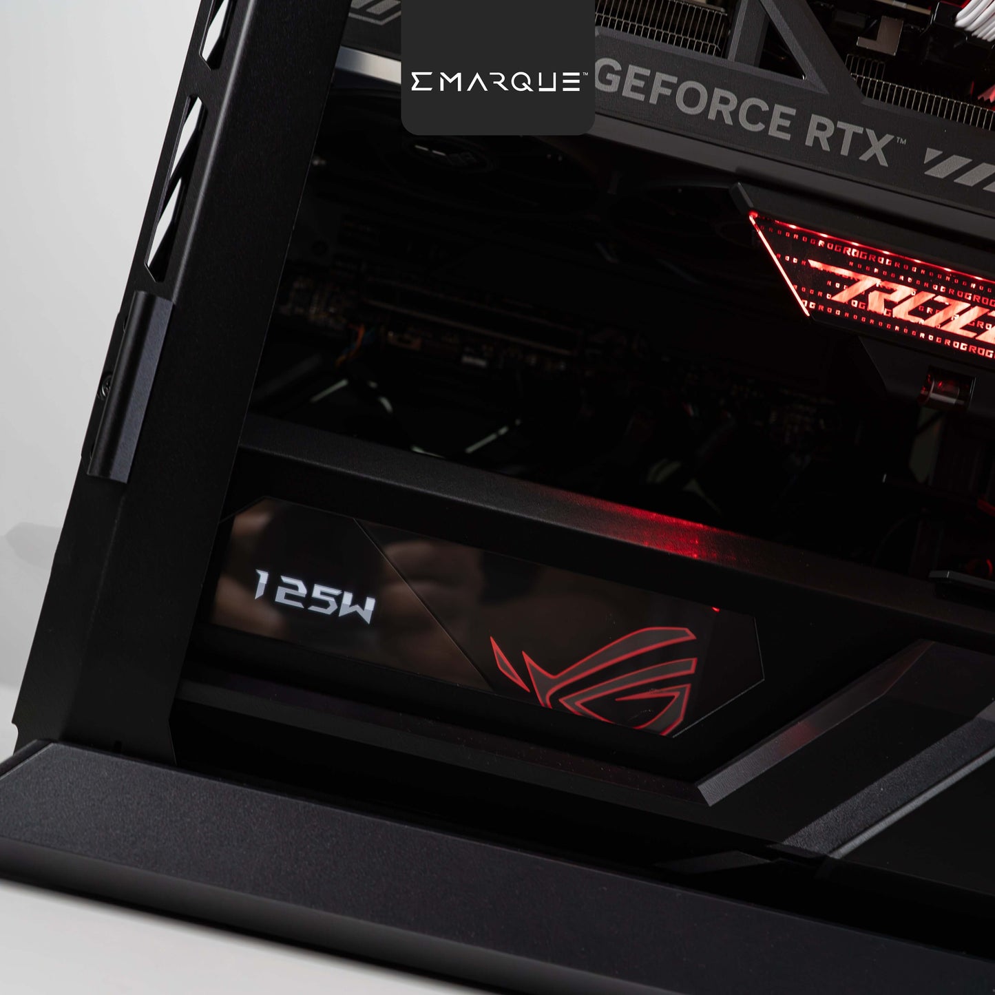 Close-up of ASUS ROG Hyperion gaming PC with GeForce RTX graphics and AMD Ryzen 7, showcasing advanced cooling and design.